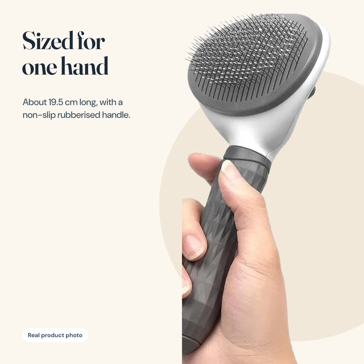The self-cleaning slicker brush held in one hand